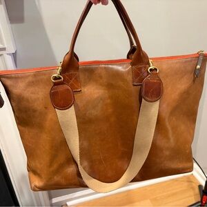 The Hugh Crossbody in Chestnut poppy zipper and detachable straps.